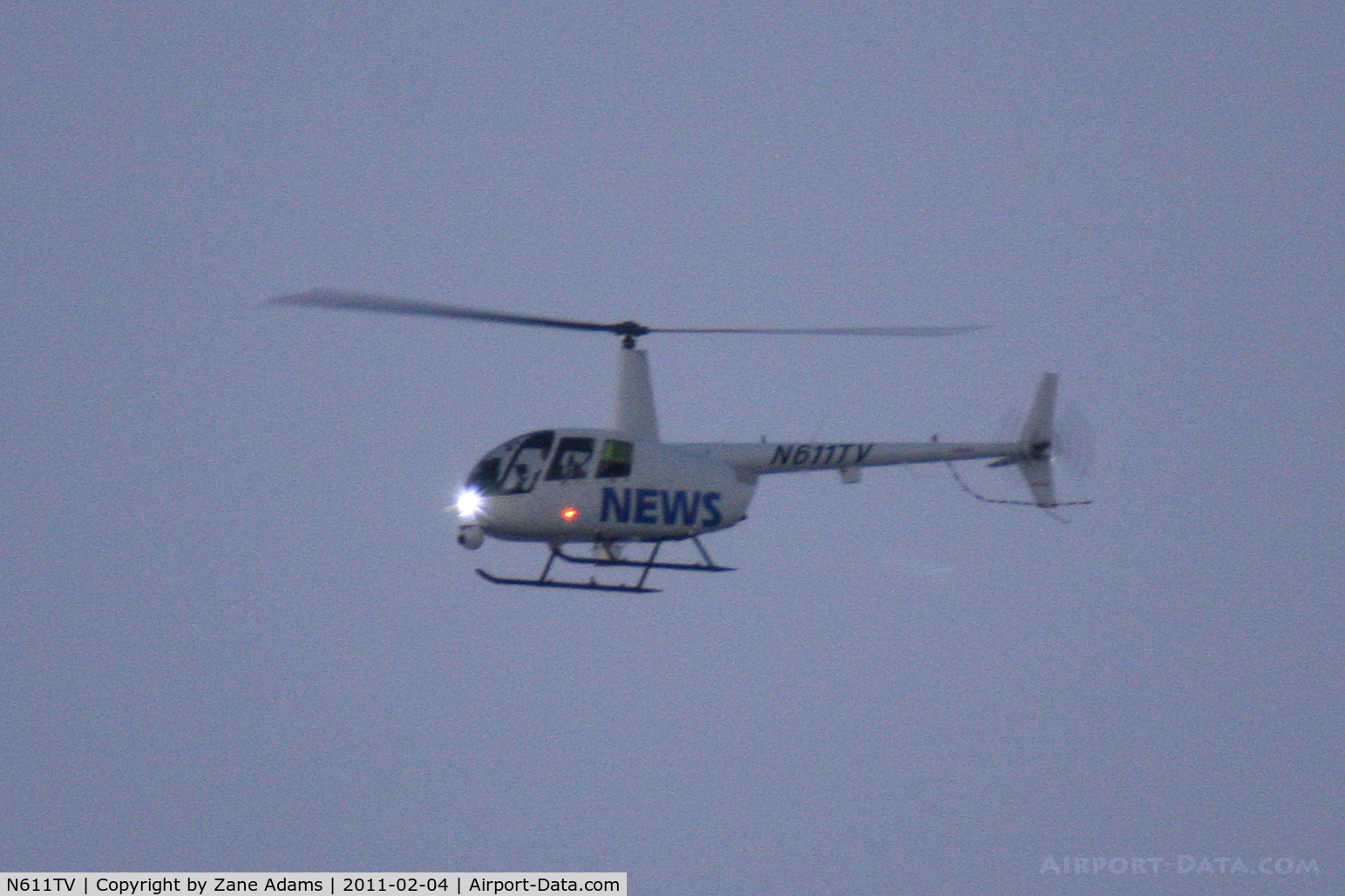 N611TV, Robinson R44 II C/N 12902, News helicopter hovering over Cowboys Stadium before Super Bowl XLV