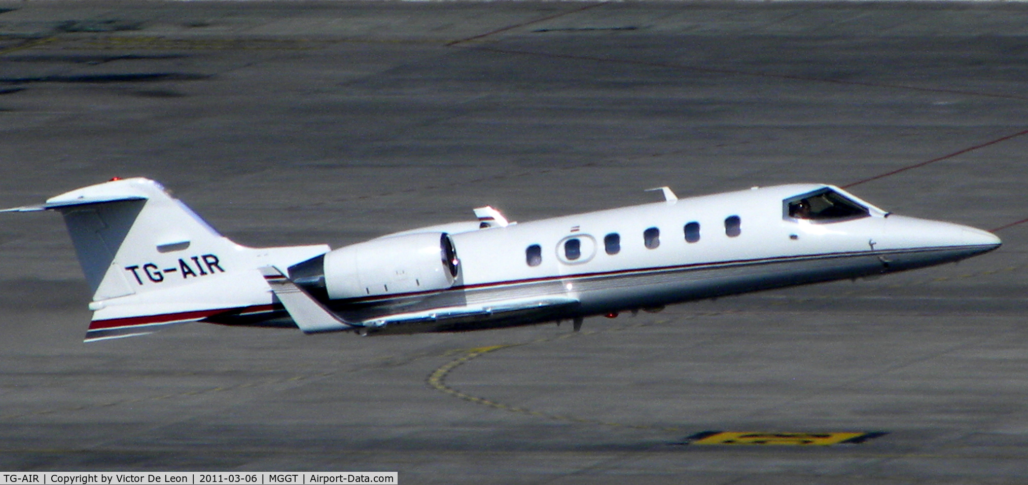 TG-AIR, 2010 Learjet 60 C/N 377, taking off from La Aurora int. airport at Guatemala city. this photo was taken from the roof top of the Crown Planza hotel.