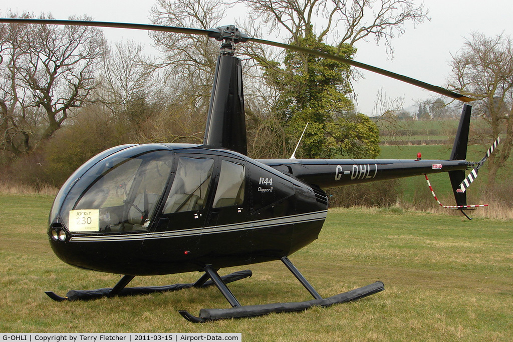 G-OHLI, 2005 Robinson R44 Clipper II C/N 10832, Visitor to Day 1 of the 2011 Cheltenham Horseracing Festival