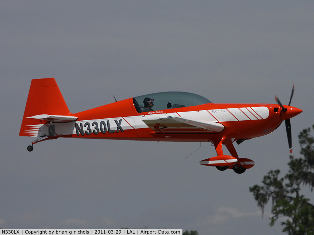 N330LX, Extra EA-300LC C/N LC001, Arriving at Sun 'n Fun, Lakeland, 2011