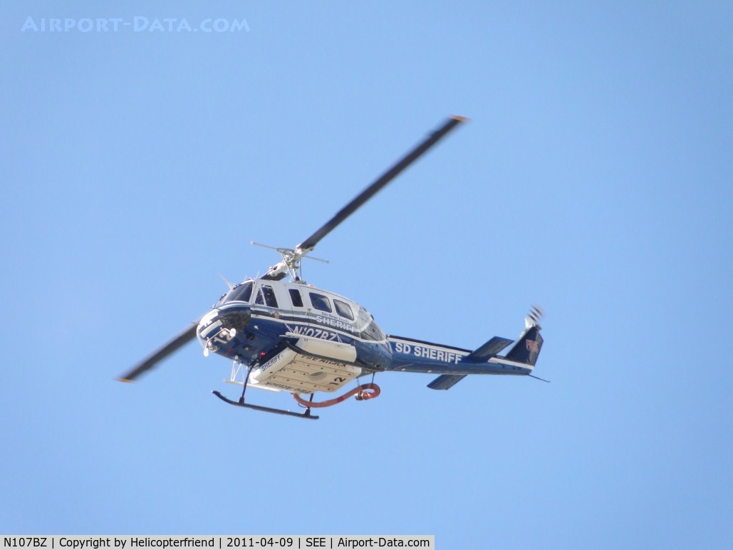 N107BZ, 1968 Bell 205A-1 C/N 30013, Crossing over the threshold for runway 17