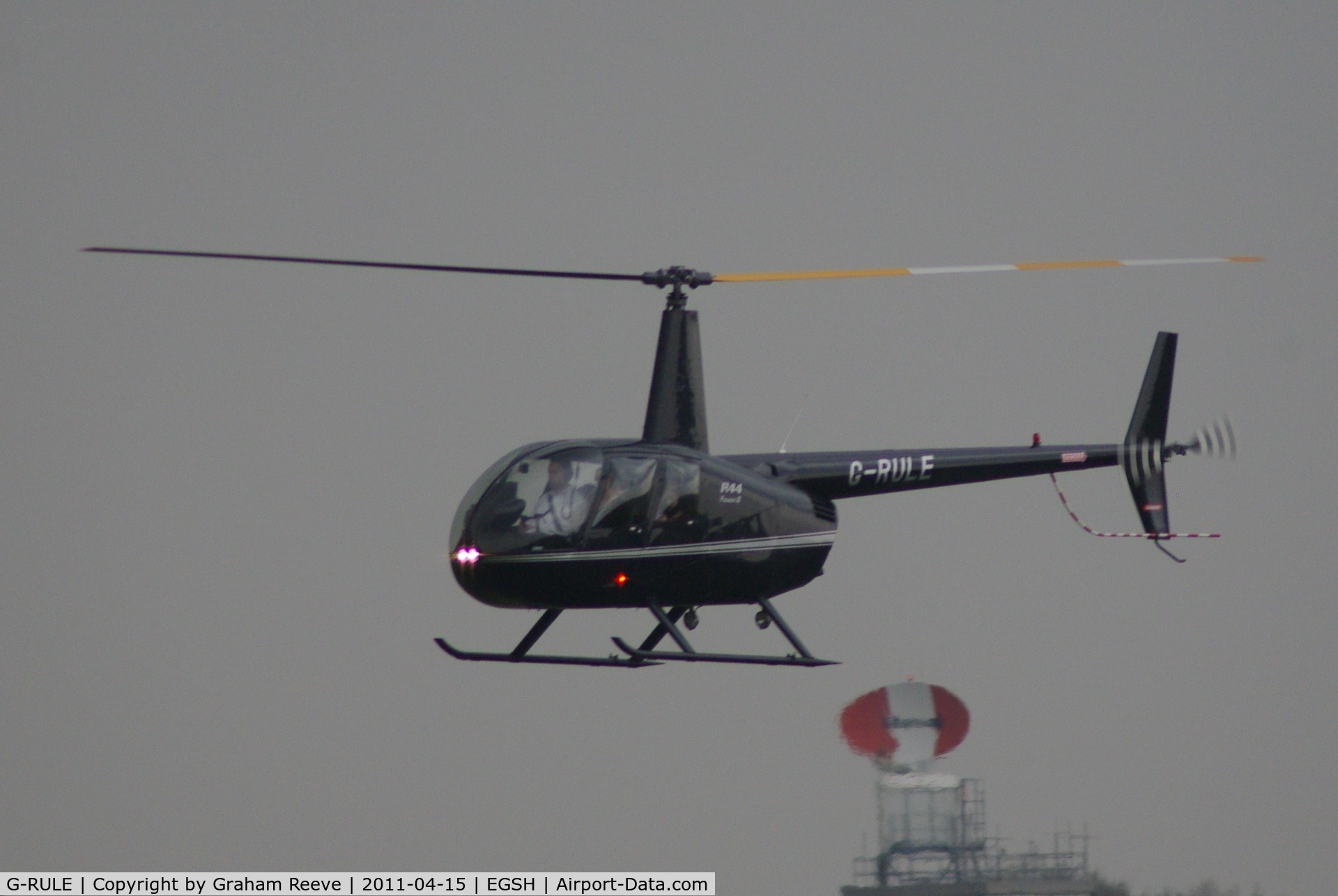 G-RULE, 2005 Robinson R44 Raven II C/N 11039, About to touch down.