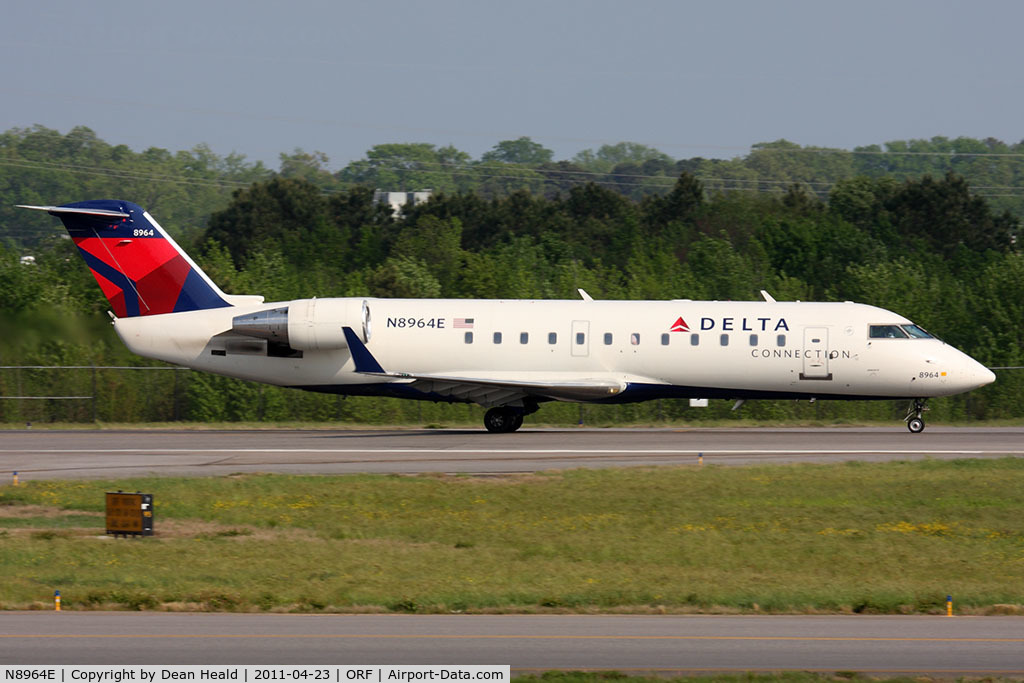 N8964E, 2004 Bombardier CRJ-200 (CL-600-2B19) C/N 7964, Delta Connection (Pinnacle Airlines) N8964E (FLT FLG4227) on takeoff roll RWY 23 en route to Boston Logan Int'l (KBOS).