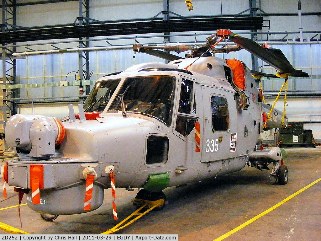 ZD252, 1982 Westland Lynx HMA.8SRU C/N 255, inside Hangar 13, 815 NAS, maintenance hangar, 'HMS Wave Ruler' on nose