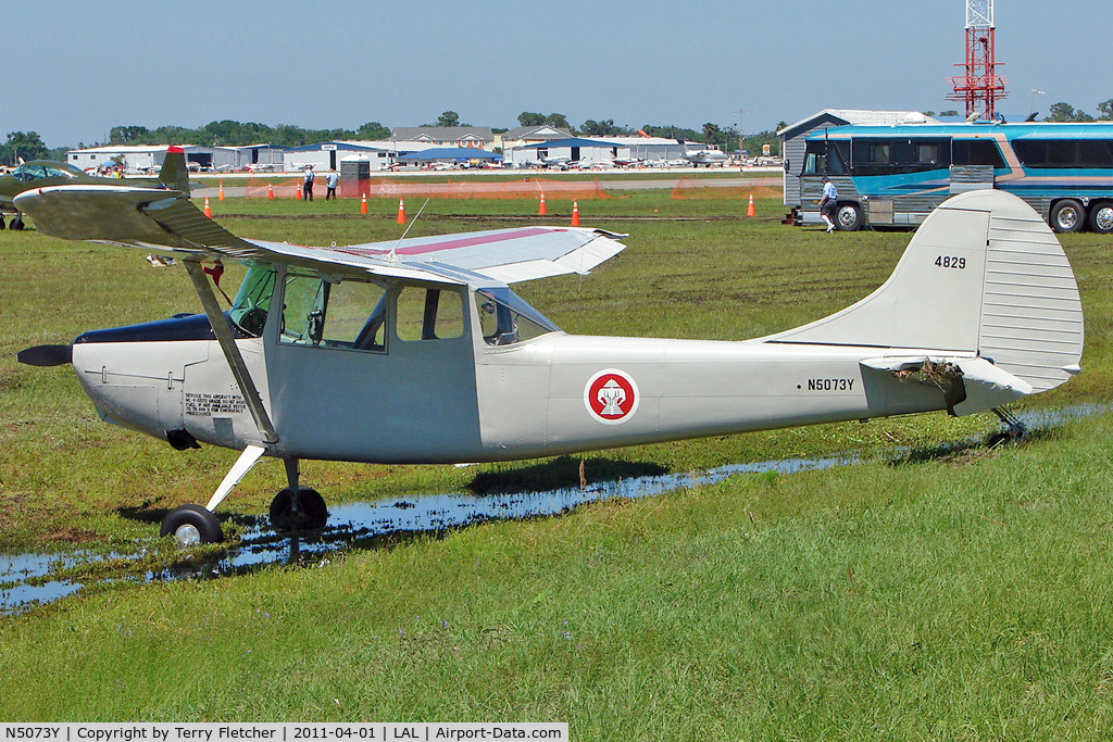 N5073Y, Cessna 305A C/N 21714, Storm battered at 2011 Sun n Fun Lakeland , Florida