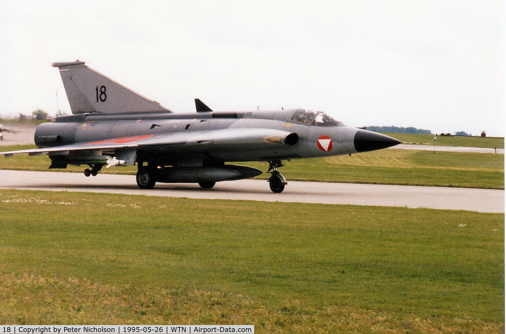 18, Saab J-35Oe MkII Draken C/N 35-1418, Austrian Air Force Draken on detachment to RAF Waddington taxying to the active runway in May 1995.
