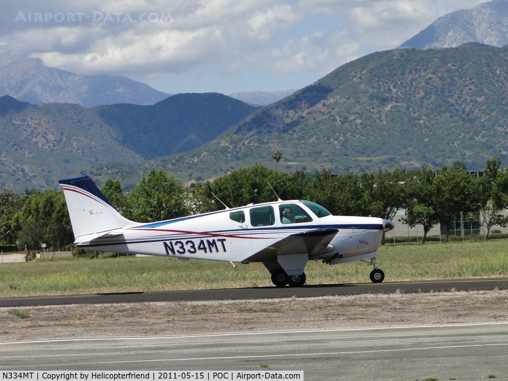 N334MT, 1962 Beech 35-B33 Debonair C/N CD-520, Taxiing to runway 26L on taxiway Sierra
