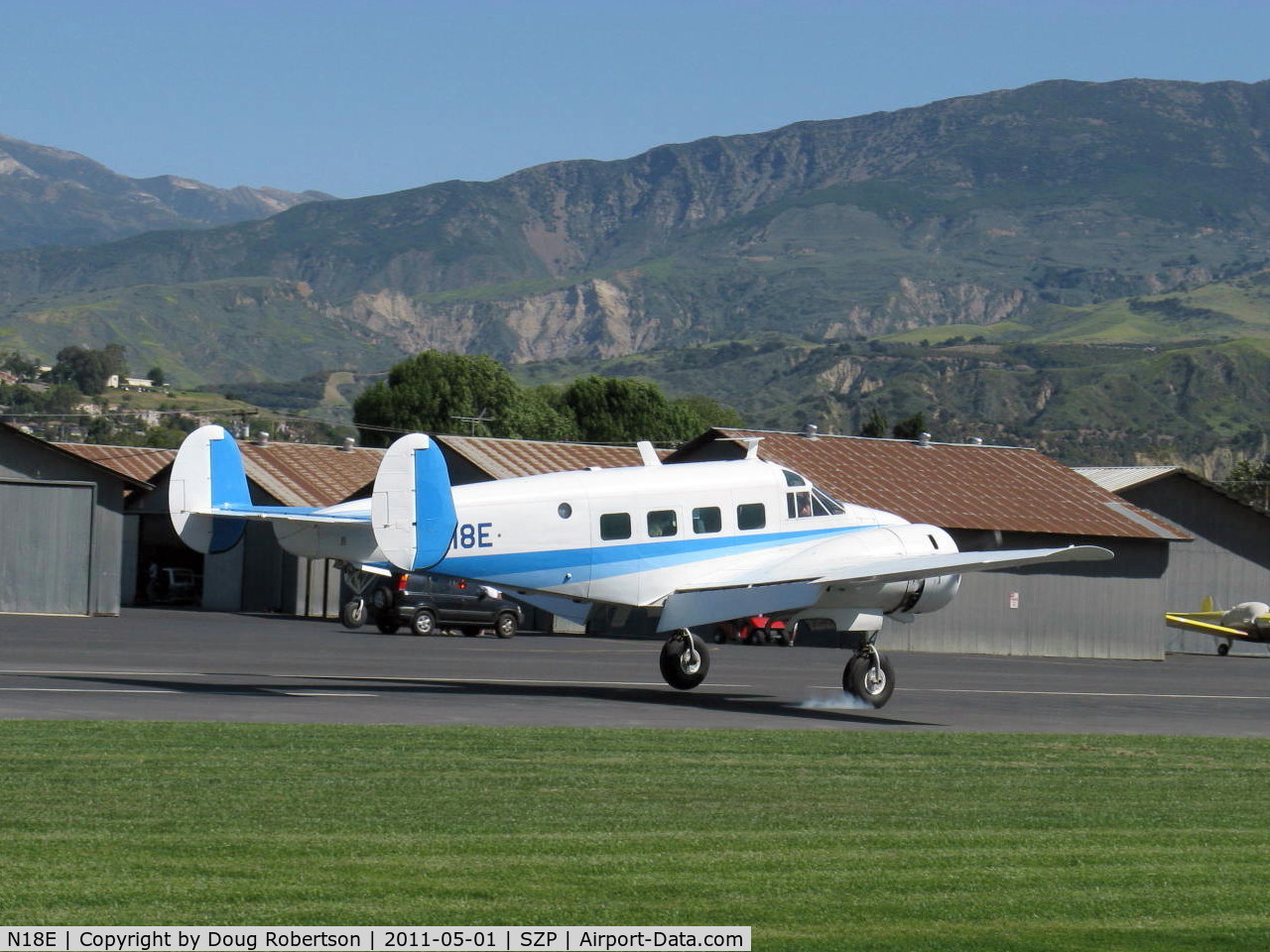 N18E, 1958 Beech E18S C/N BA-383, 1958 Beech SUPER E18S, 2 P&W R-985 Wasp Jrs. 450 Hp each, smoke one main on landing Rwy 04. The E model 18 starting in 1954 was the first of the Super models, followed by the G18S & choice of H18 tri-gear or conventional gear versions. Shot timing lucky!