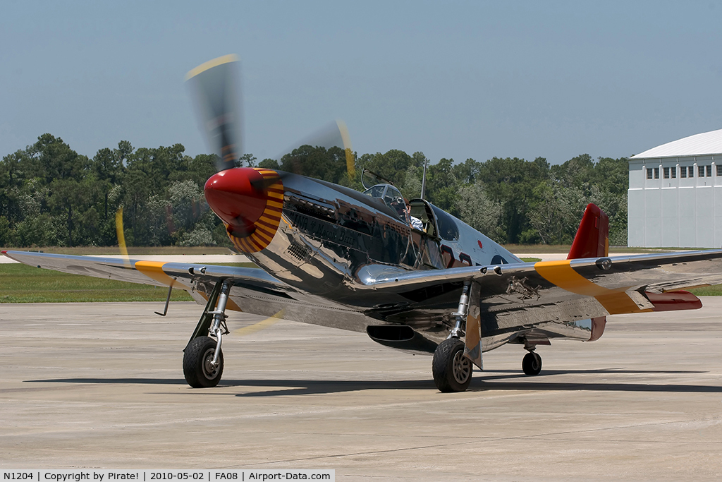 N1204, 1944 North American P-51C Mustang C/N 103-26385, Kermit Weeks, pilot and owner of Fantasy of Flight, taxis back after the afternoon flying display in the P51-C 