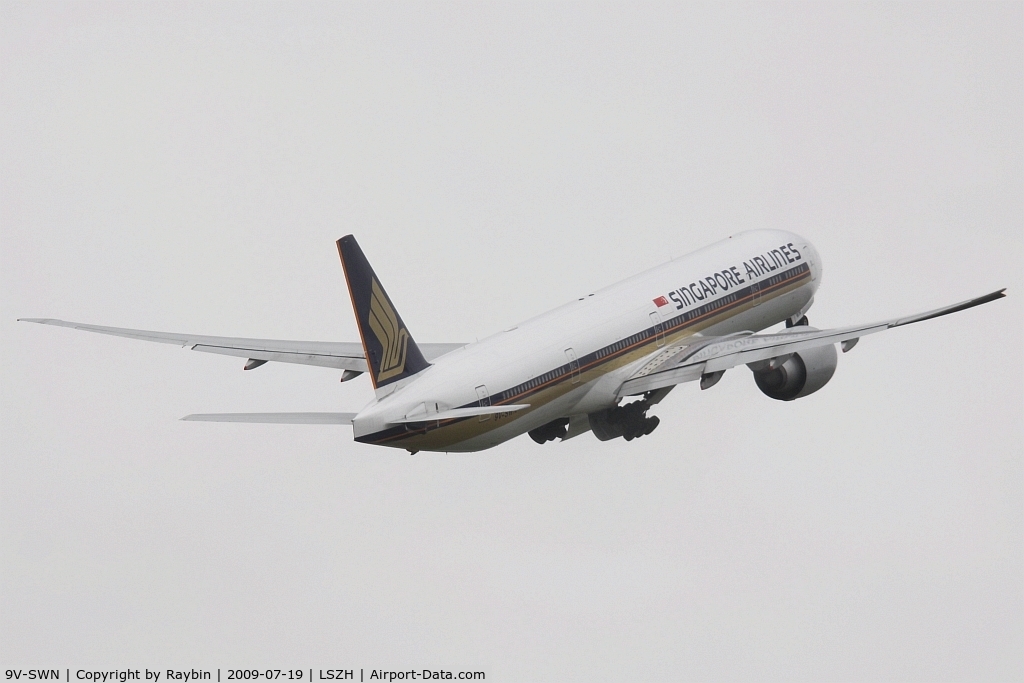 9V-SWN, 2008 Boeing 777-312/ER C/N 34579, flying away into the grey sky