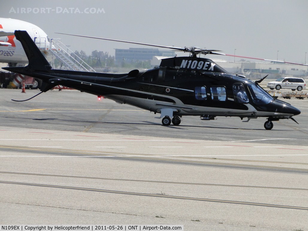 N109EX, Agusta A-109S Grand C/N 22145, Taxiing into the parking area to pick up passenger