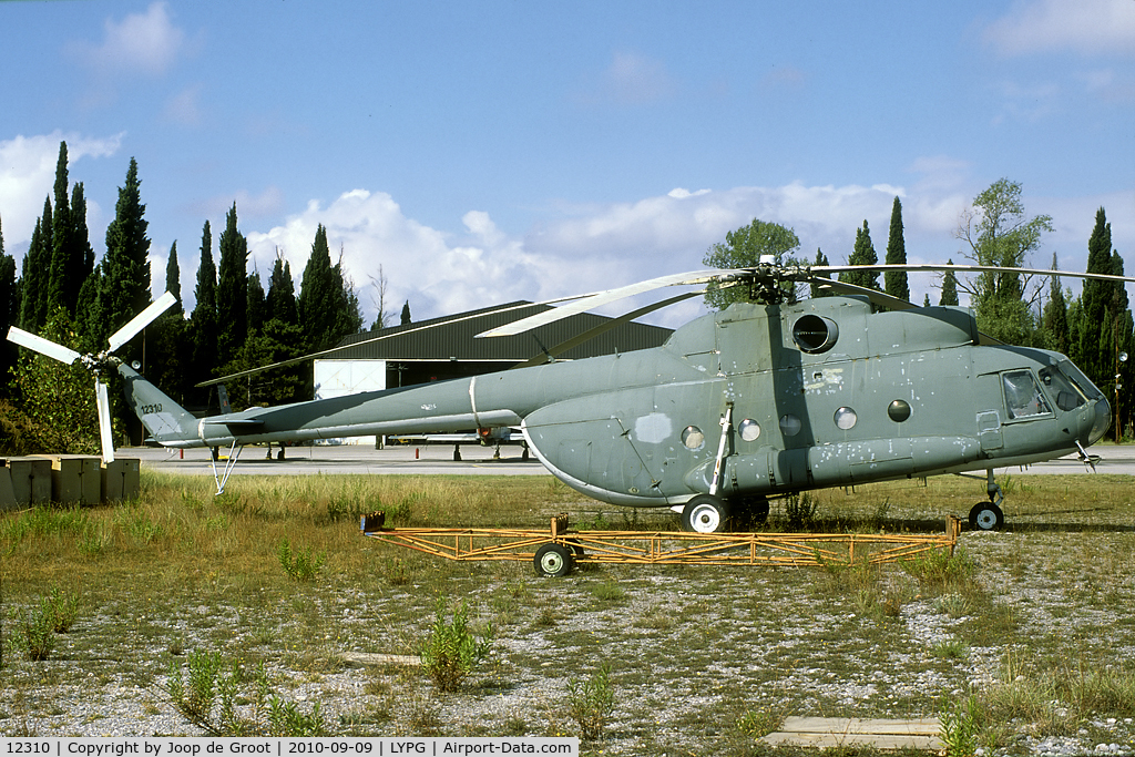 12310, Mil Mi-8T C/N 0000, After the separation of Serbia and Montenegro this Mi-8 was transferred to the Montenegrin AF. They did not take it on charge, so it it resting in the grass near the main flight lines.