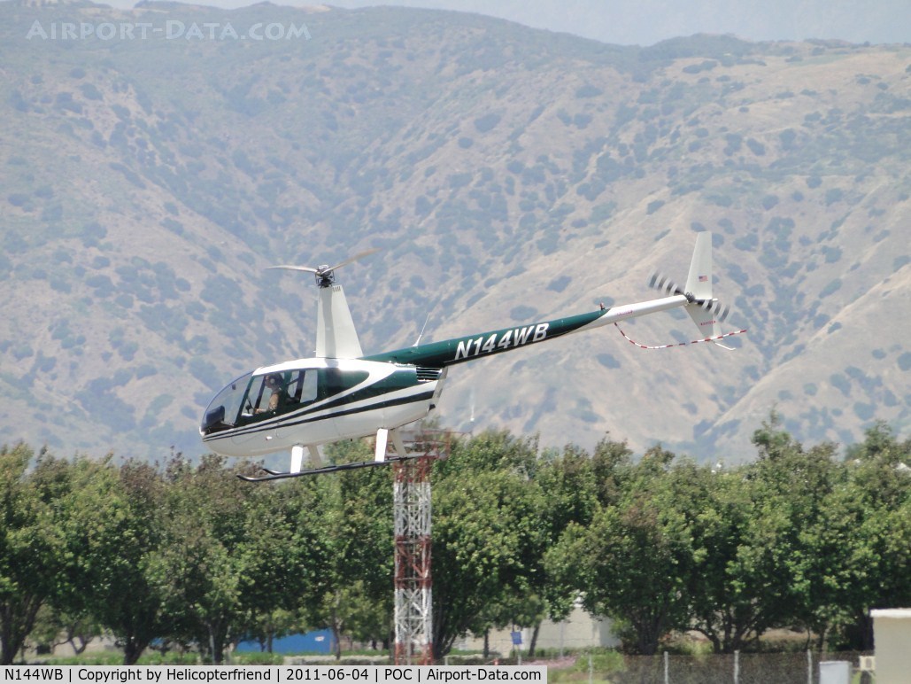 N144WB, 1998 Robinson R44 C/N 0545, Finished hovering into runway 26L and nose is down and the Robinson departs westbound