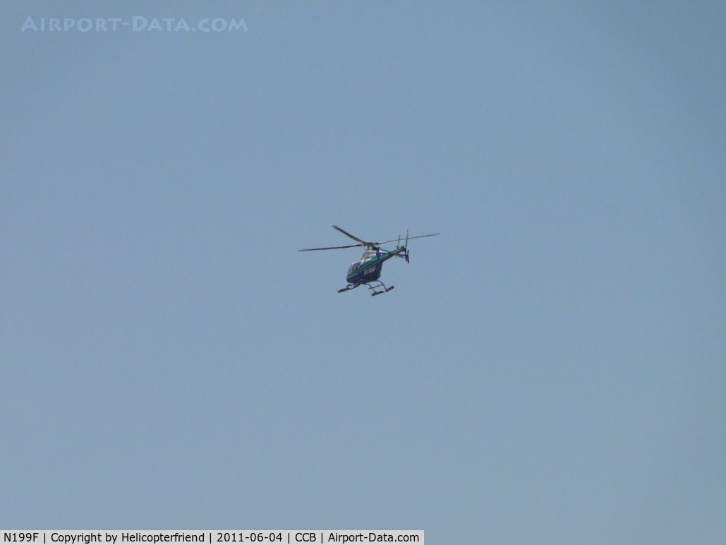 N199F, 2003 Bell 407 C/N 53574, Heading west from Cable