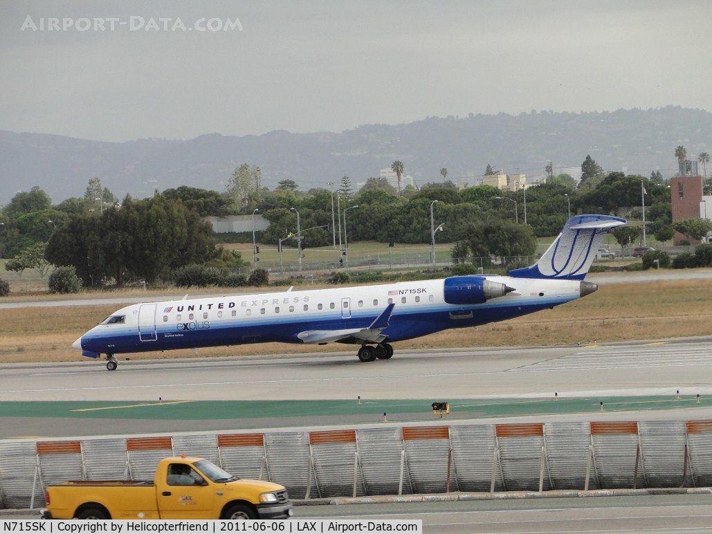 N715SK, 2004 Bombardier CRJ-700 (CL-600-2C10) Regional Jet C/N 10179, Waiting to take off on runway 24L