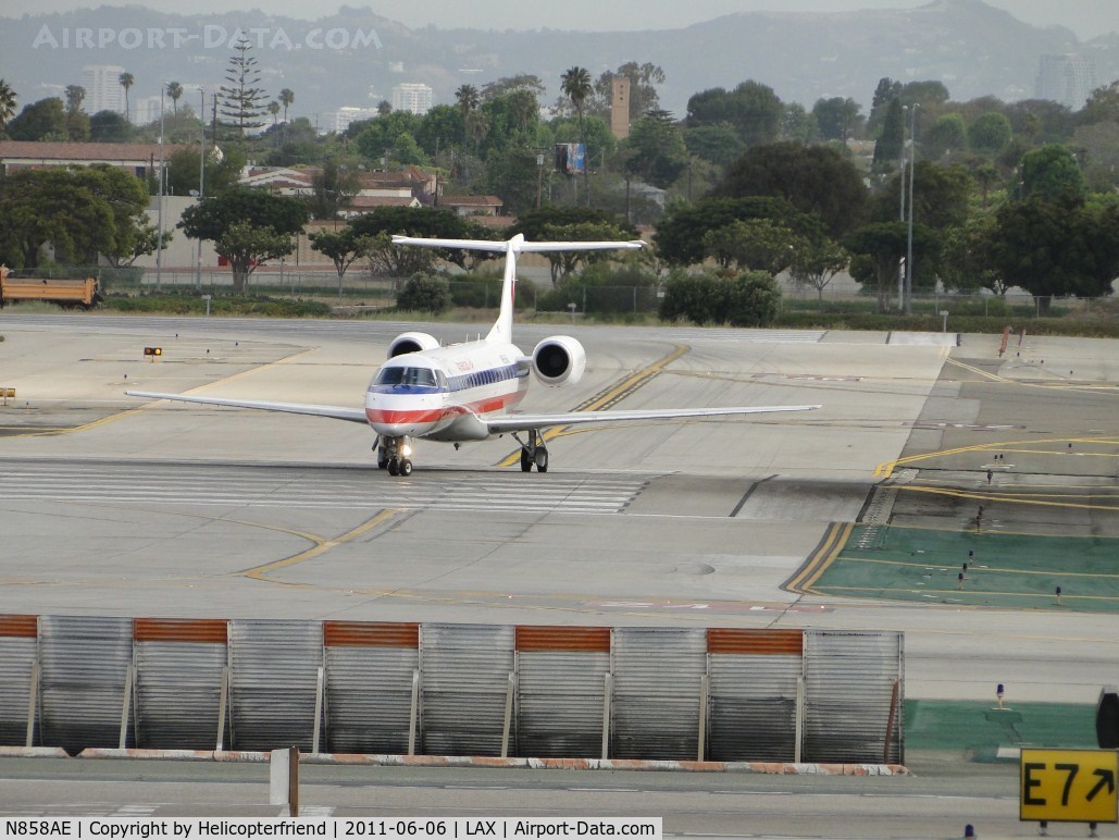 N858AE, 2003 Embraer ERJ-140LR (EMB-135KL) C/N 145754, Taxiing southbound to enter runway 24L