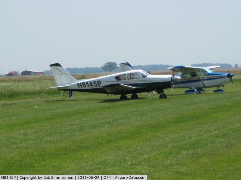 N8145P, 1963 Piper PA-24 Comanche C/N 24-3398, Parked in the grass at Mt. Victory, Ohio