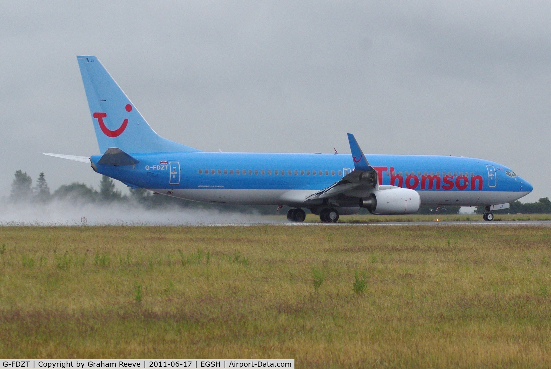 G-FDZT, 2011 Boeing 737-8K5 C/N 37248, Taking off on a wet afternoon.