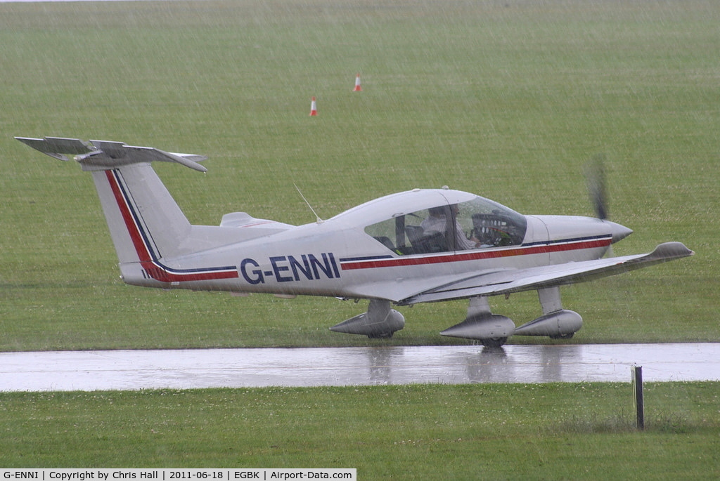 G-ENNI, 1987 Robin R-3000-180 C/N 128, arriving during one of the rain storms at at AeroExpo 2011