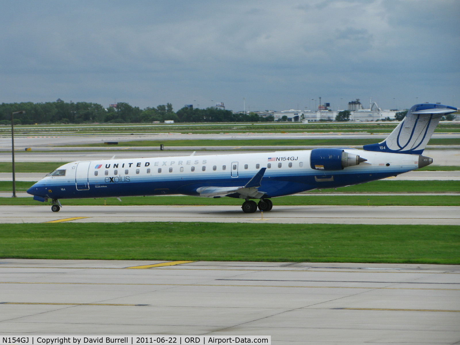 N154GJ, 2005 Bombardier CRJ-702 (CL-600-2C10) Regional Jet C/N 10224, United Express Bombardier CL-600-2C10 taxiing at Chicago O'hare Airport.