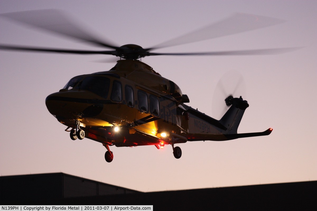 N139PH, 2008 AgustaWestland AW-139 C/N 31121, PHI AW 139 leaving Heliexpo Orlando at dusk