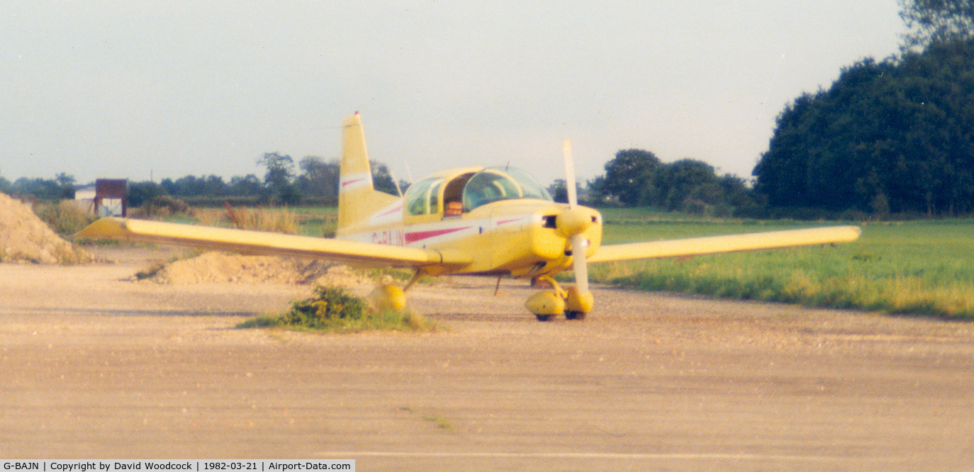 G-BAJN, 1972 American Aviation AA-5 Traveler C/N AA5-0259, March 1982 with a very yellow colour scheme, landed at melbourne disused airfield to watch some Gyrocopters. Home base then was Sherburn in Elmet. Excuse quality of photo and scan
