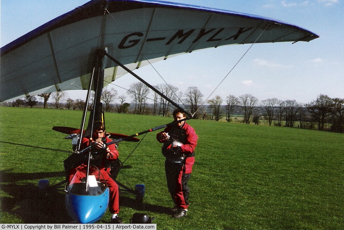 G-MYLX, 1993 Medway Raven X C/N MRB113/109, John (pilot) and passenger preparing for flight from Haxted April 1995
