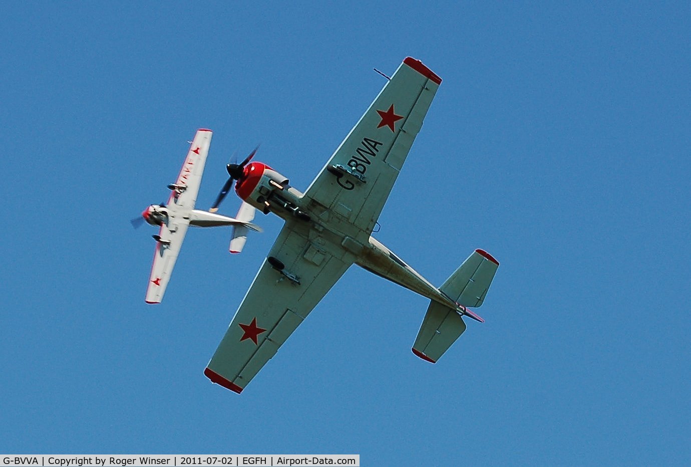 G-BVVA, 1987 Bacau Yak-52 C/N 877610, Run and break over Runway 22 by Osprey 2 after formation aerobatics practice.