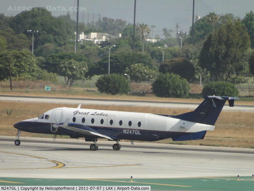 N247GL, 1996 Beech 1900D C/N UE-247, Starting westerly roll for take off on runway 24L