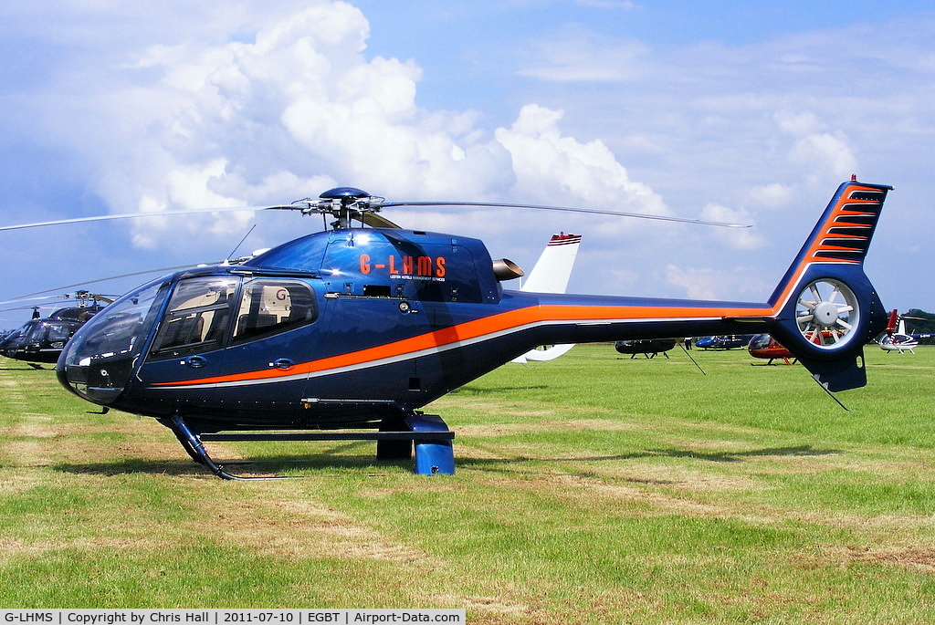 G-LHMS, 2006 Eurocopter EC-120B Colibri C/N 1442, being used for ferrying race fans to the British F1 Grand Prix at Silverstone