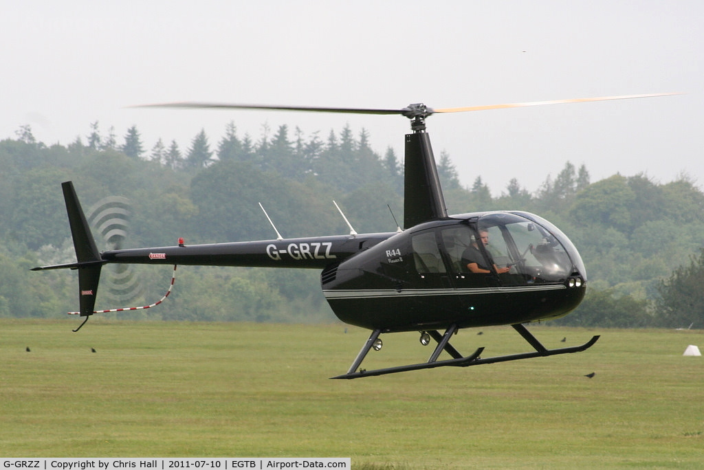 G-GRZZ, 2008 Robinson R44 Raven II C/N 12149, being used for ferrying race fans to the British F1 Grand Prix at Silverstone