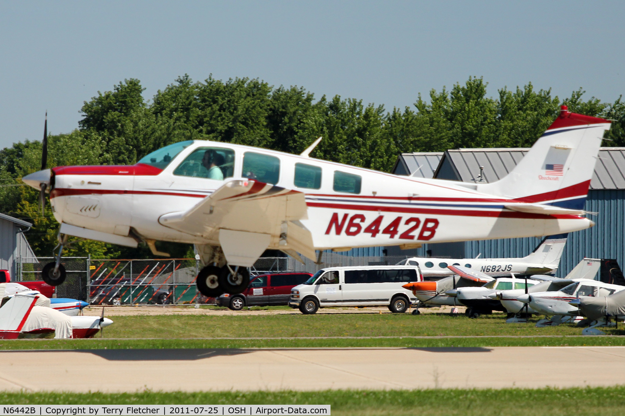N6442B, 1982 Beech A36 Bonanza 36 C/N E-1957, 1982 Beech A36, c/n: E-1957 landing at 2011 Oshkosh