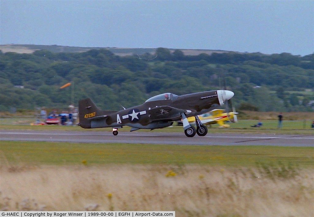G-HAEC, 1951 Commonwealth CA-18 Mustang 22 (P-51D) C/N CACM-192-1517, Displayed at the Swansea Airport Airshow in 1989. Became BIG BEAUTIFUL DOLL. Registered D-FBBD in June 2011.