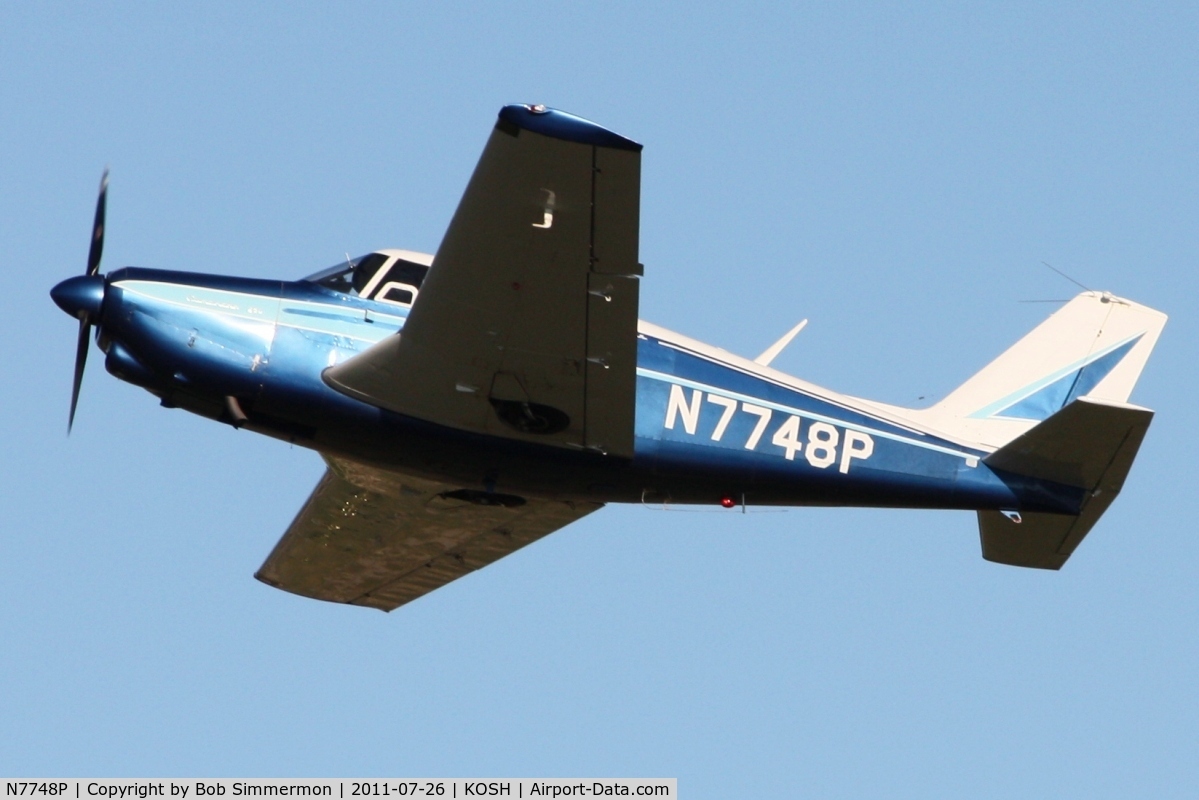 N7748P, 1961 Piper PA-24-250 Comanche C/N 24-2963, Departing Airventure 2011.