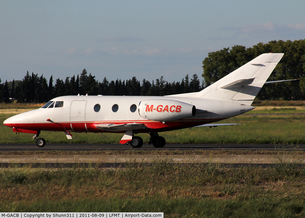 M-GACB, 1974 Dassault Falcon 10 C/N 22, Parked at the General Aviation area...