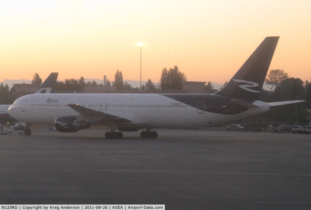 N125RD, 1990 Boeing 767-383/ER C/N 24849, Ryan International Airlines Boeing 767-383ER being towed to a gate.