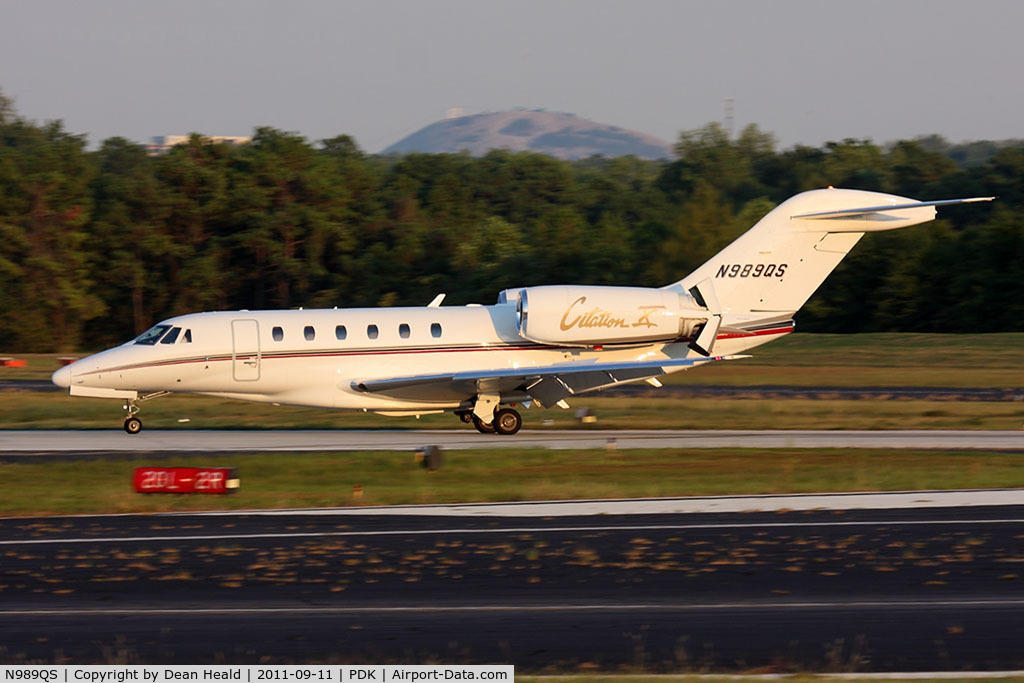N989QS, 1999 Cessna 750 Citation X Citation X C/N 750-0089, NetJets N989QS rolling out on RWY 2R after arrival from Tampa Int'l (KTPA). Stone Mountain can be seen in the background.