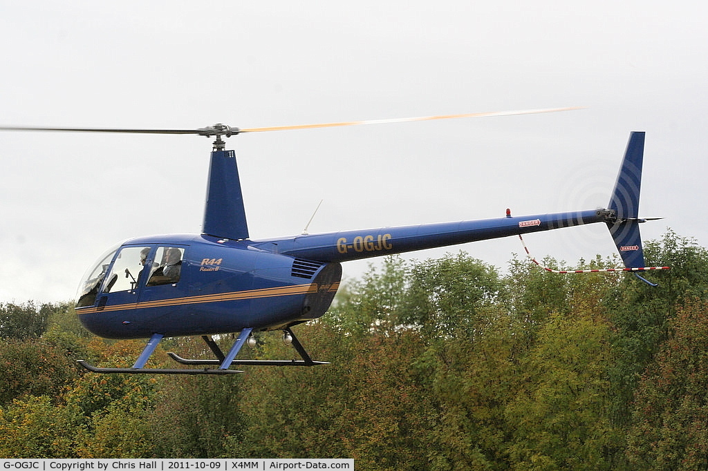 G-OGJC, 2009 Robinson R44 Raven II C/N 11653, At a fly-in at Manley Mere, Cheshire. Organised by Helicentre Liverpool in aid of the North West Air Ambulance