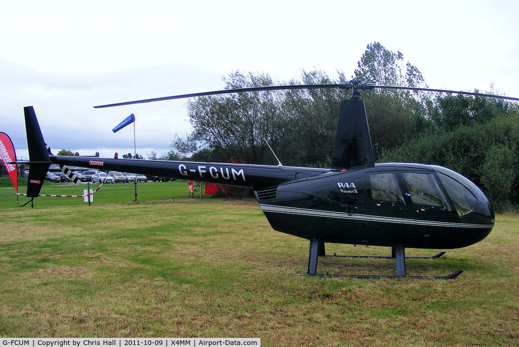 G-FCUM, 2007 Robinson R44 Raven II C/N 11723, At a fly-in at Manley Mere, Cheshire. Organised by Helicentre Liverpool in aid of the North West Air Ambulance