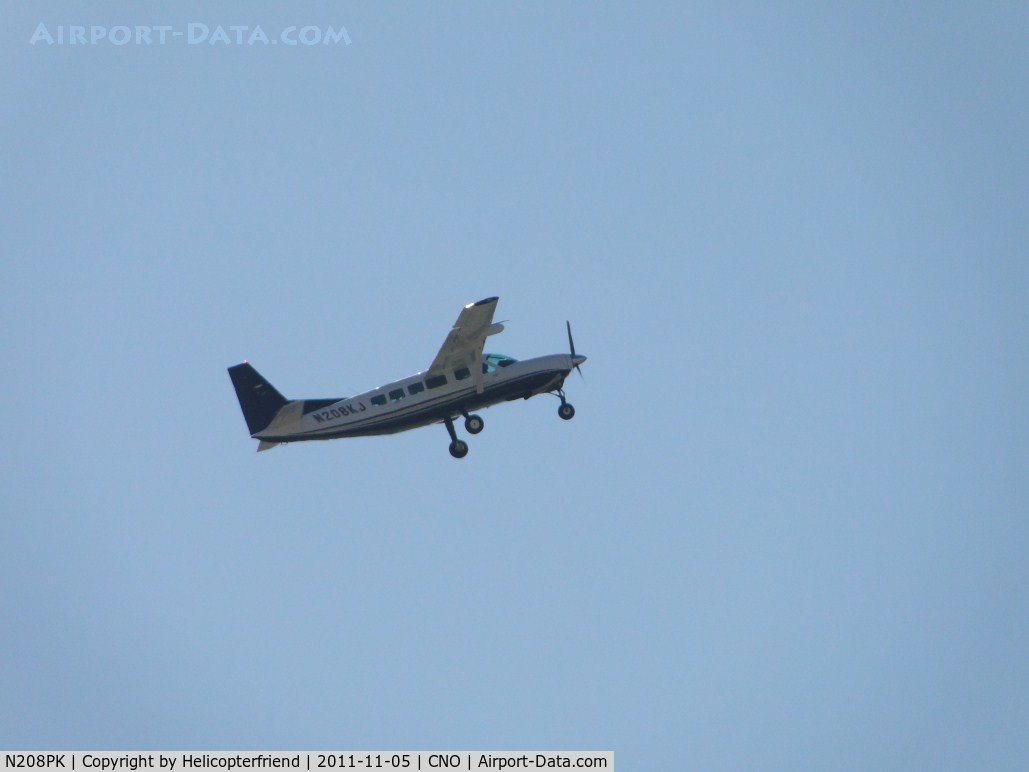 N208PK, 2005 Cessna 208B C/N 208B1143, Climbing out after take off