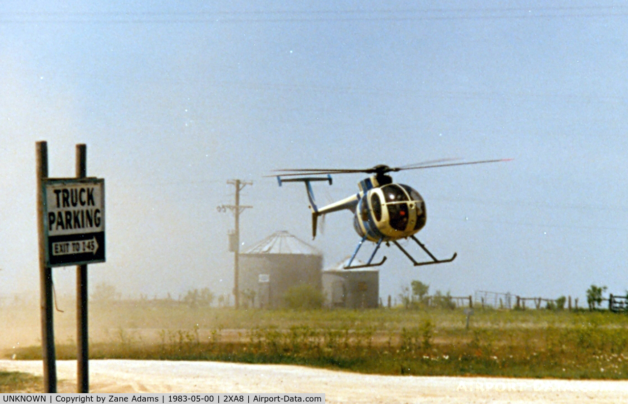 UNKNOWN, Helicopters Various C/N unknown, Hughes 500 landing at a truckstop along I-45 near Wortham, TX