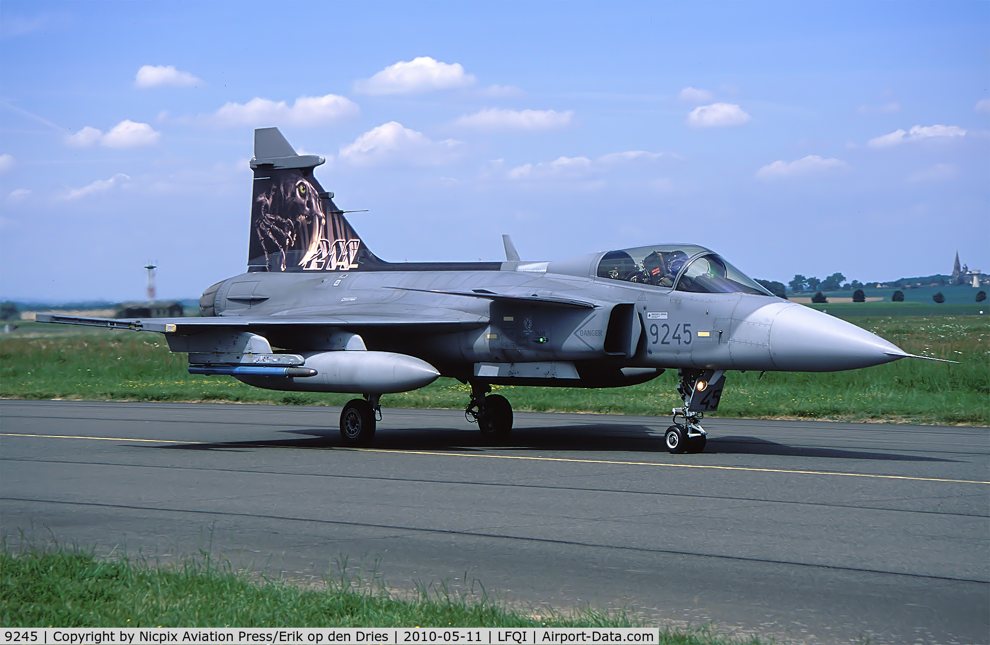 9245, Saab JAS-39C Gripen C/N 39245, As extinct tigers are tigers too, this Czech AF JAS-39C was painted with a ghostly Sabre-Tooth Tiger on the tail.