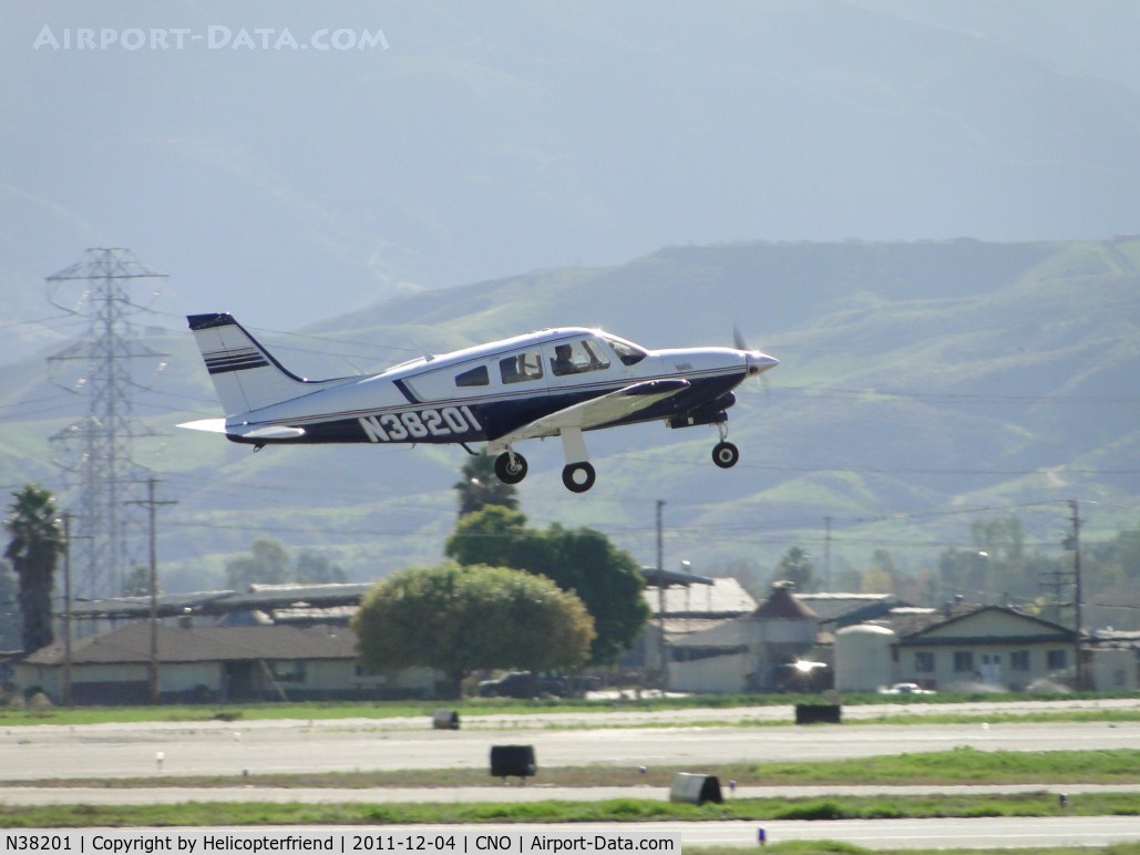 N38201, Piper PA-28R-201T Cherokee Arrow III C/N 28R-7703188, Taking off from runway 26R and heading west