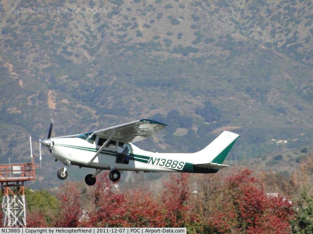 N1388S, 1976 Cessna 182P Skylane C/N 18264949, Airbourne from runway 26R, passing the autumn trees