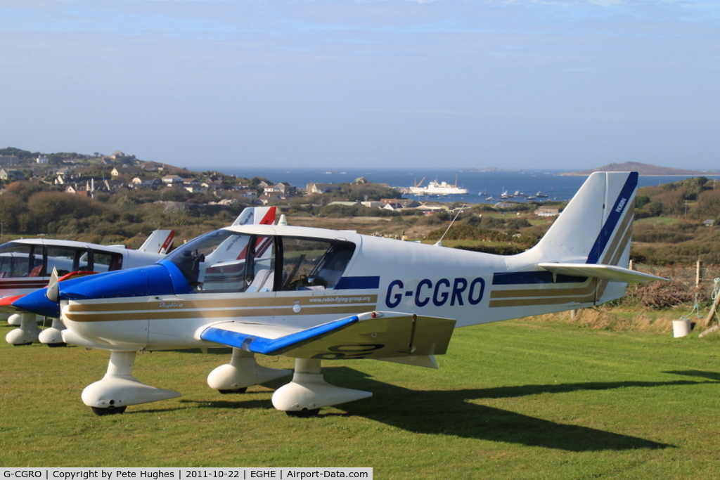 G-CGRO, 1995 Robin DR-400-140B Major C/N 2272, G-CGRO, one of a flight of three DR400s visiting St Marys Isles of Scilly - view across Hugh Town to the Scillonian at the quay