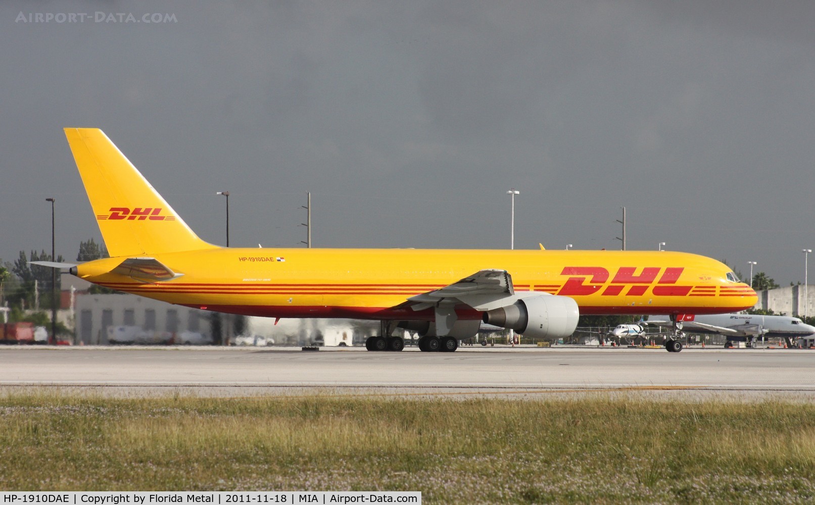 HP-1910DAE, 1998 Boeing 757-200 C/N 29607, DHL Aero Expreso 757 doing the unusual, departing on Runway 8R due to runway 9 being closed for morning maintenance - taken from photo holes on 25th St.