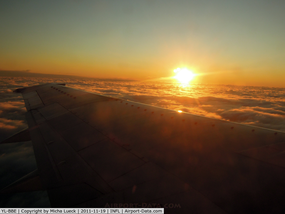 YL-BBE, 1998 Boeing 737-53S C/N 29073, Sunrise over the Baltic Sea, on route from Helsinki to Riga