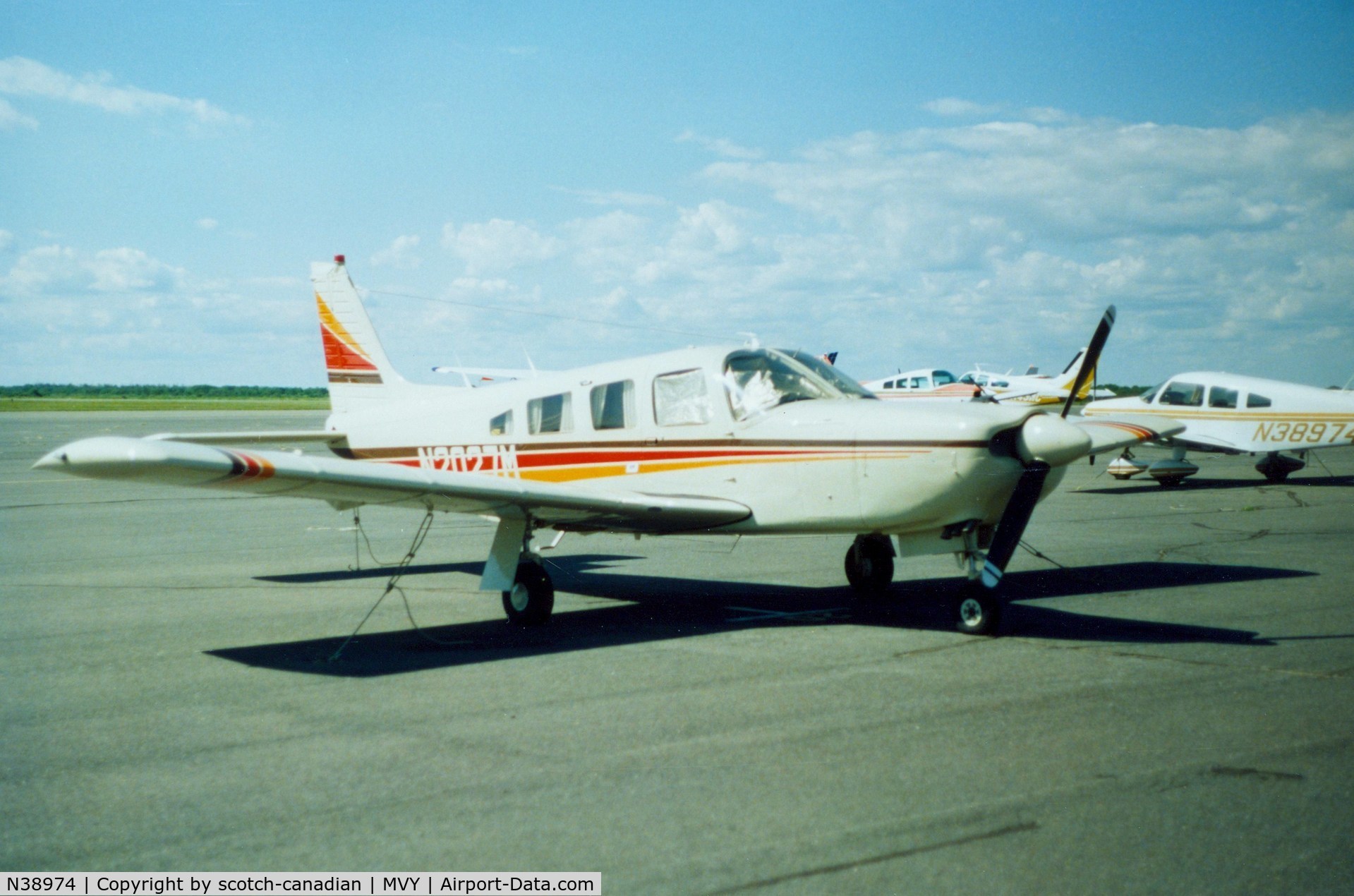 N38974, Piper PA-28-161 C/N 28-7716305, Piper PA-28-161 N38974 in background at Martha's Vineyard Airport, Vineyard Haven, MA - July 1986