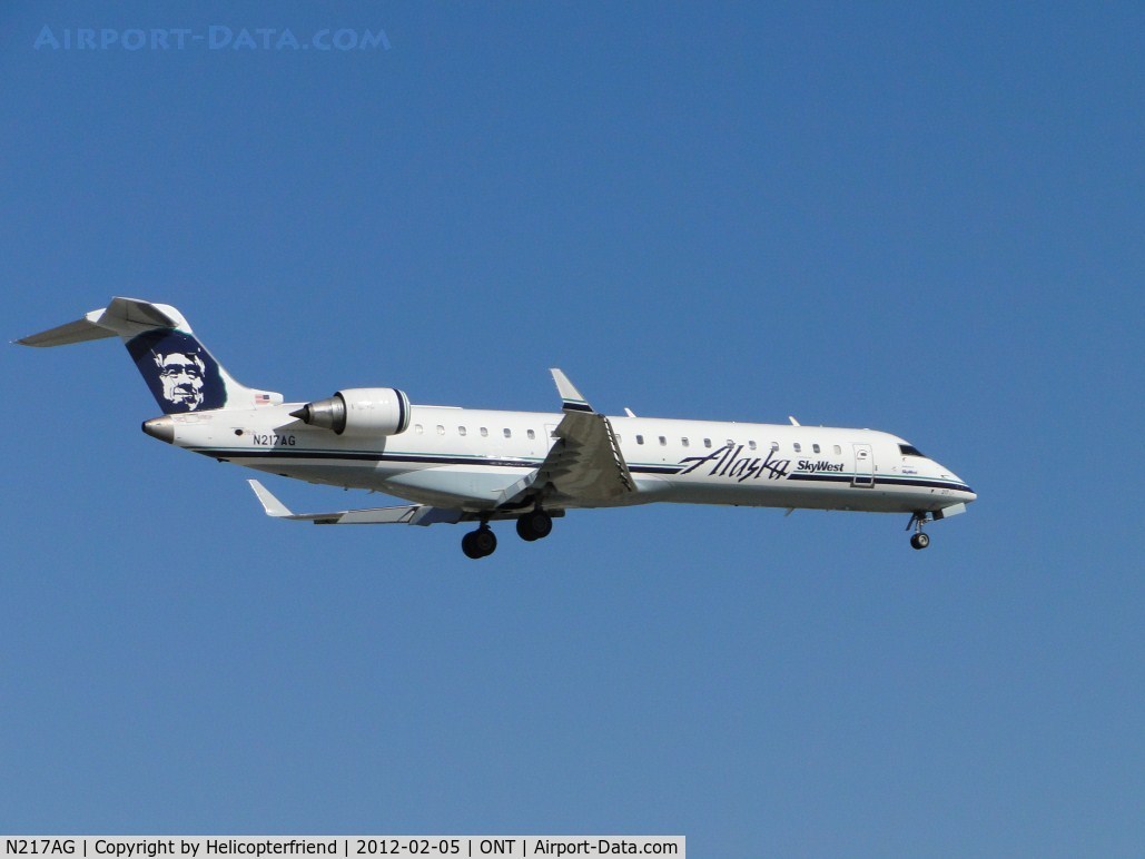 N217AG, 2001 Bombardier CRJ-701 (CL-600-2C10) Regional Jet C/N 10031, On final to runway 8L, just passed the outer fence