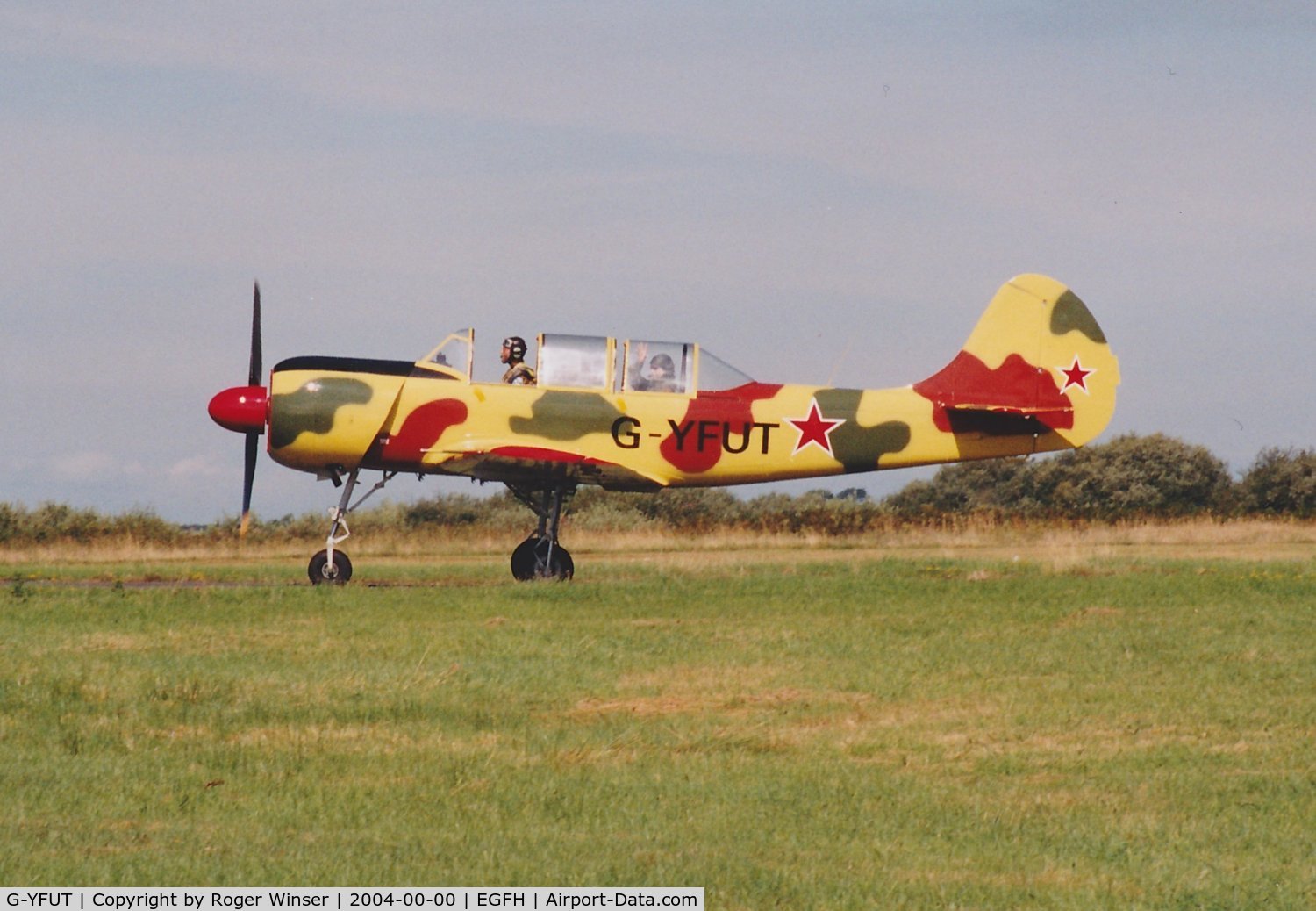 G-YFUT, 1988 Bacau Yak-52 C/N 888410, Returning to base after formation aerobatics practice. July/August 2004.